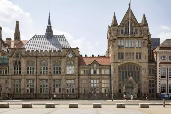 Manchester Museum photographed on a bright day from across the street