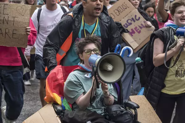 A member of Balmy Army shouting into a megaphone during the MIF23 march