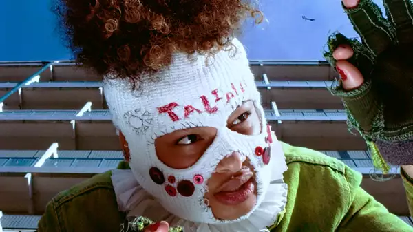 TaliaBle wearing a white, knitted balaclava
